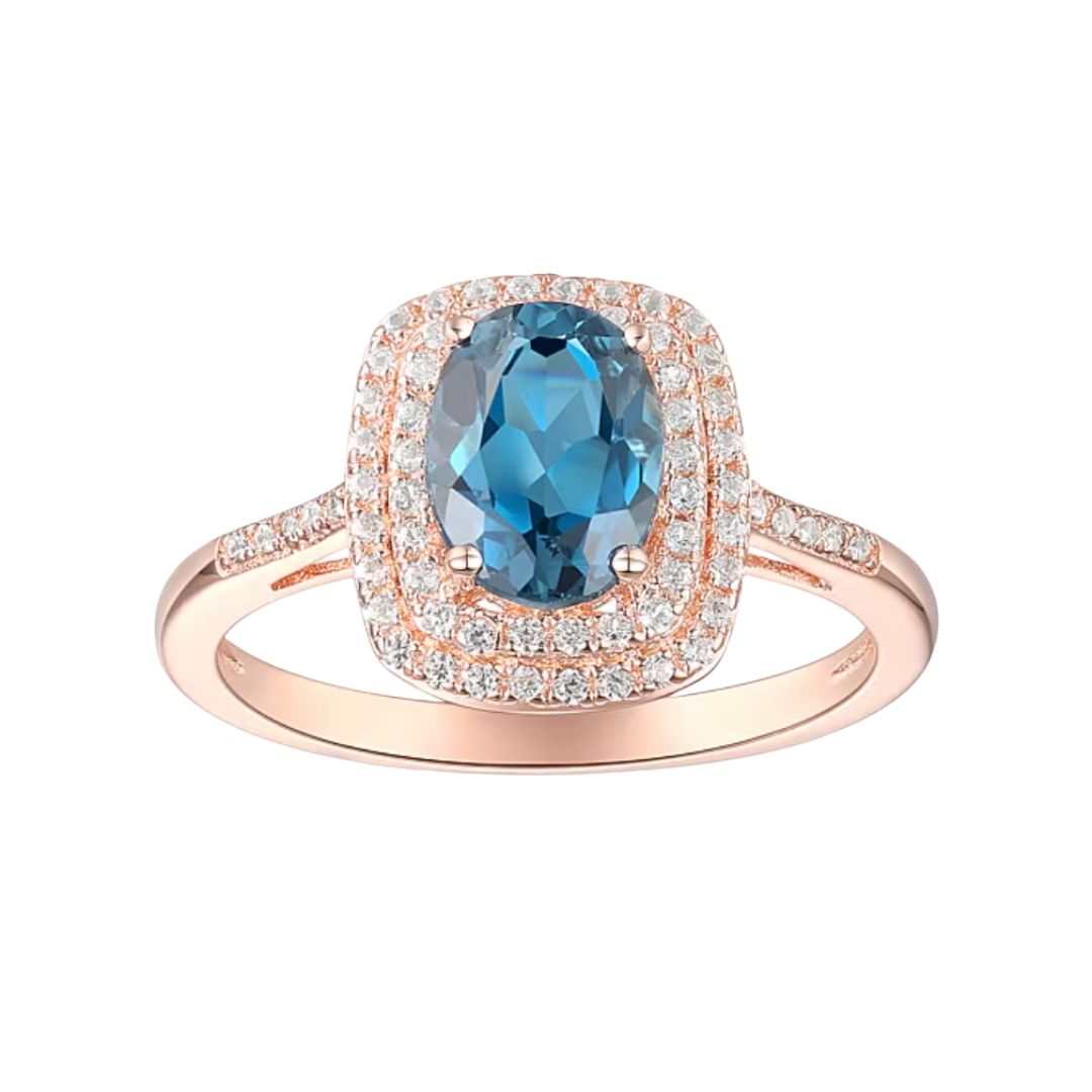 Anillo Topacio London Blue y Zafiro Blanco de Laboratorio en Plata con baño de oro Rosado