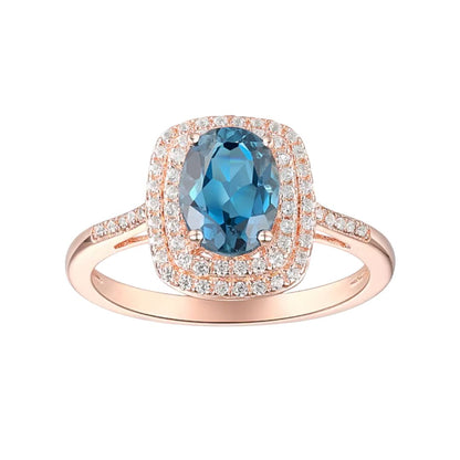 Anillo Topacio London Blue y Zafiro Blanco de Laboratorio en Plata con baño de oro Rosado