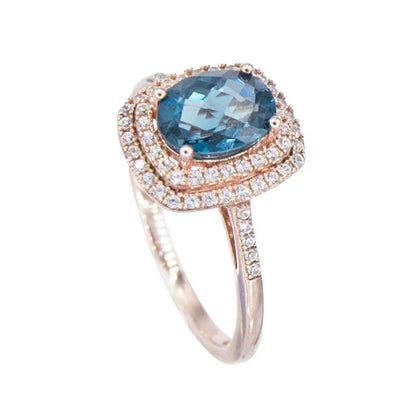 Anillo Topacio London Blue y Zafiro Blanco de Laboratorio en Plata con baño de oro Rosado