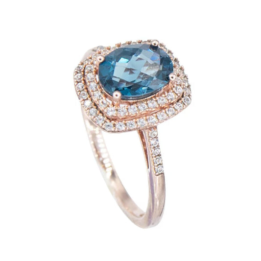 Anillo Topacio London Blue y Zafiro Blanco de Laboratorio en Plata con baño de oro Rosado